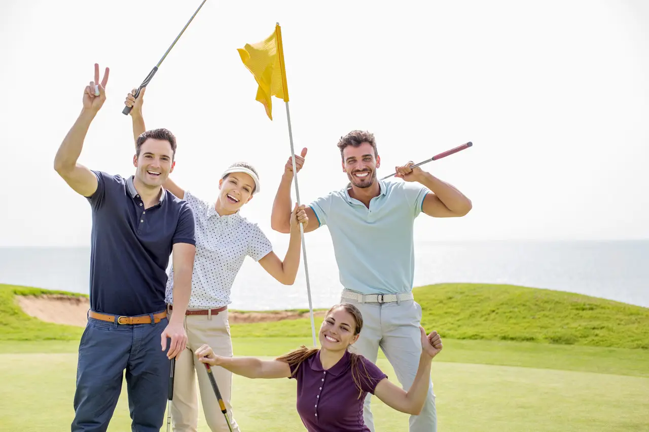 Enthusiastic friends waving on golf course